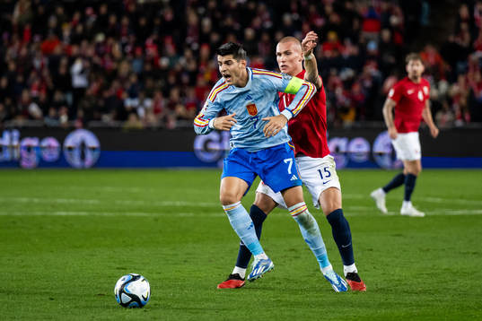 Álvaro Morata of Spain and Leo Østigård of Norway