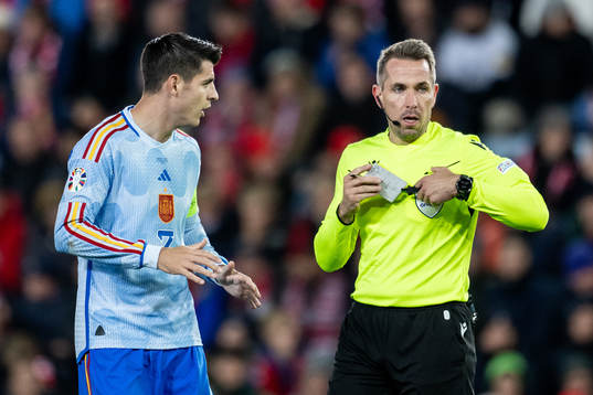 Álvaro Morata of Spain and Referee Tobias Stieler