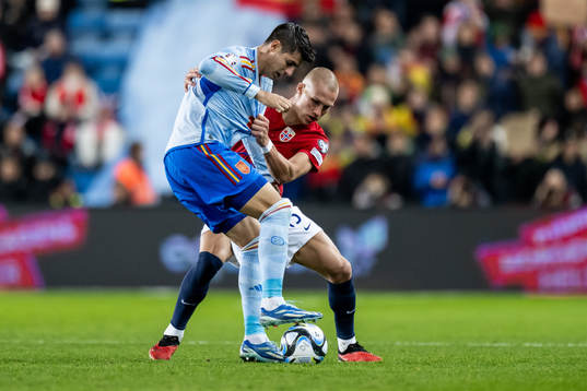 Álvaro Morata of Spain and Leo Østigård of Norway