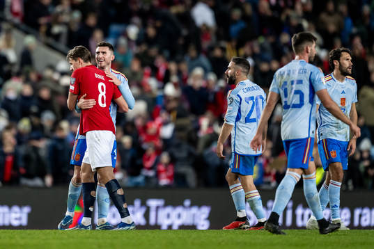 Sander Berge of Norway and Aymeric Laporte of Spain