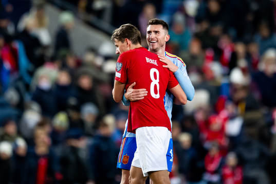 Sander Berge of Norway and Aymeric Laporte of Spain