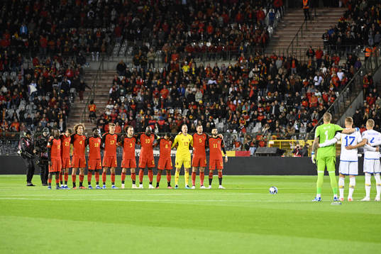 Players of Belgium pay respect to war victims in the world