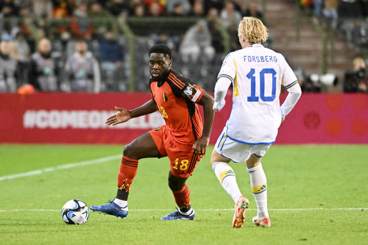 Orel Mangala of Belgium battles for the ball with Emil