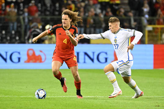 Wout Faes of Belgium battles for the ball with Viktor