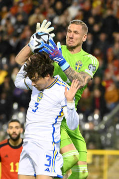 Robin Olsen of Sweden battles for the ball with Victor