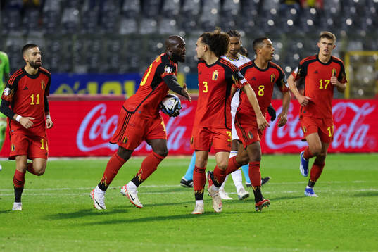 Romelu Lukaku of Belgium scores a penalty and celebrates