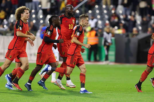Romelu Lukaku of Belgium scores a penalty and celebrates