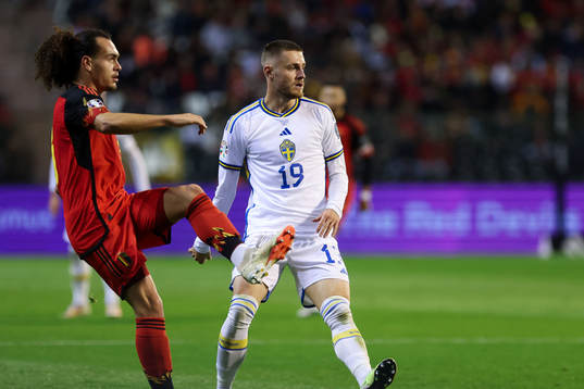 Arthur Theate of Belgium battles for the ball with Mattias