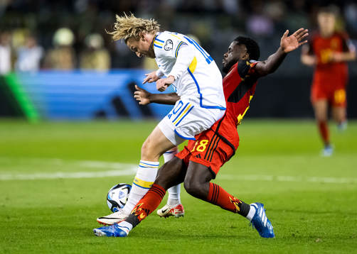Emil Forsberg of Sweden and Orel Mangala of Belgium