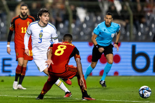 Victor Nilsson Lindelöf of Sweden and Youri Tielemans of