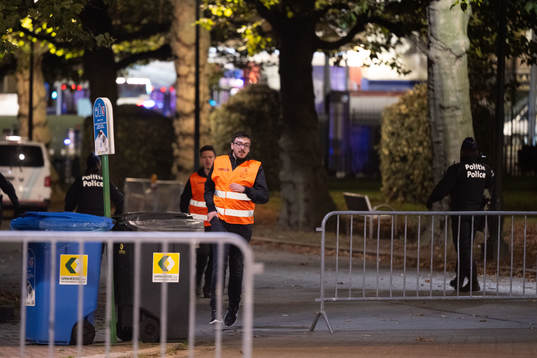 Volunteers are running outside King Baudouin Stadium