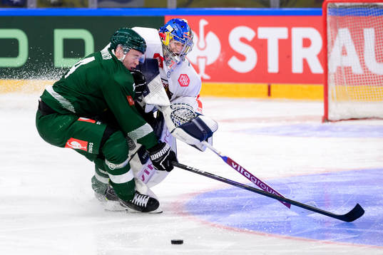 Oscar Lawner of Färjestad and goaltender Daniel Allavena