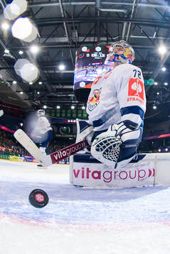 goaltender Daniel Allavena of Munich looks dejected