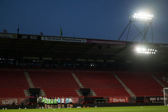 Players and staff gather