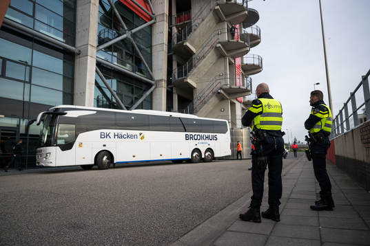 Police watch as the team bus of Häcken arrive