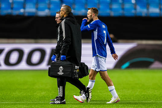 Magnus Wolff Eikrem of Molde walks off the pitch with an
