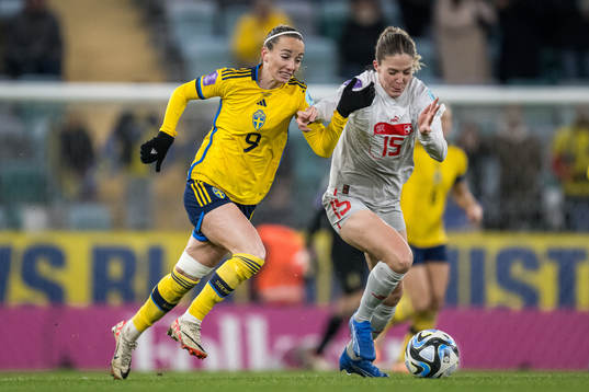 Kosovare Asllani of Sweden and  Luana Buhler of Switzerland