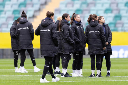 Players of Switzerland walking the pitch