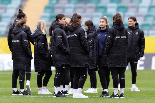 Players of Switzerland walking the pitch
