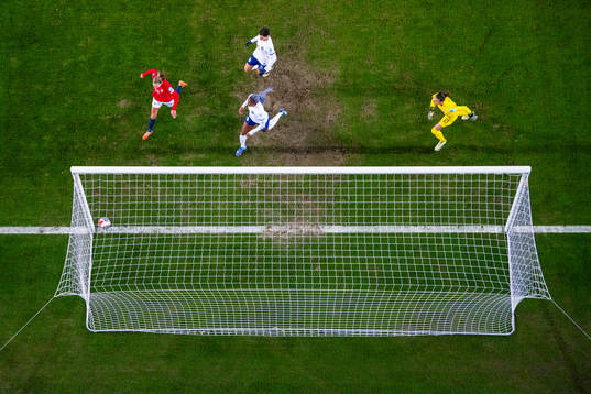 Marit Bratberg Lund of Norway scores the 1-1 goal past