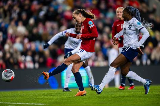 Marit Bratberg Lund of Norway scores the 1-1 goal
