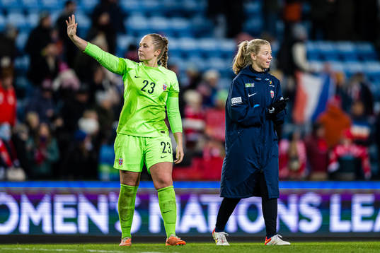 goalkeeper Aurora Mikalsen of Norway and Justine Kielland