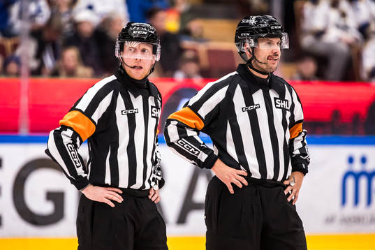 Domare Mikael Holm och Domare Johan Magnusson