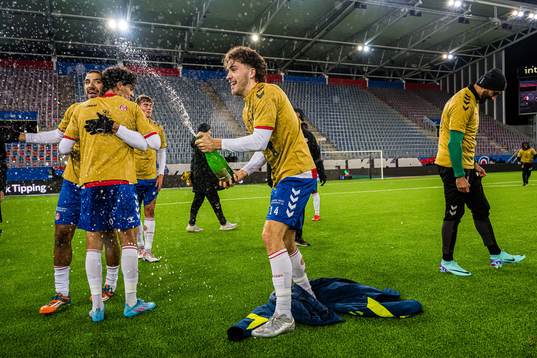 Håkon Helland Hoseth of KFUM celebrates promotion to the
