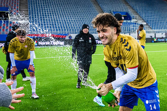 Håkon Helland Hoseth of KFUM celebrates promotion to the