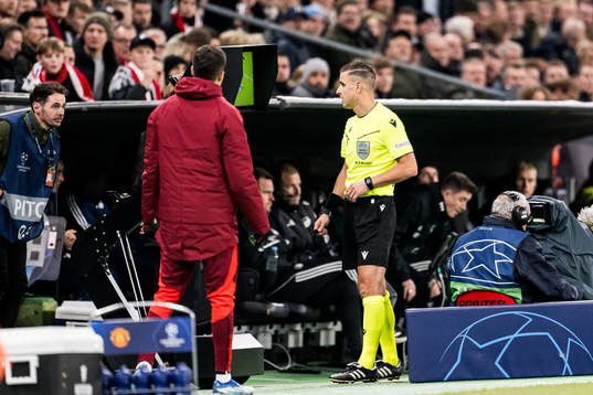 Referee Donatas Rumsas with a VAR check