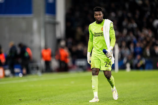 Goalkeeper André Onana of Manchester United looks dejected