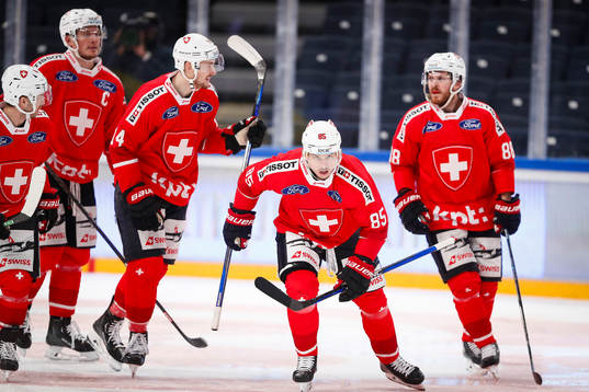 Sven Andrighetto of Switzerland celebrates with team mates