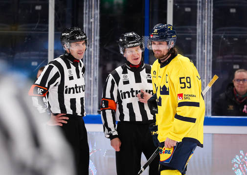 Linus Johansson of Sweden with referees Jakub Sindel and