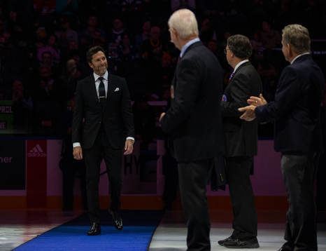 Henrik Lundqvist receives his blazer prior to the Hockey