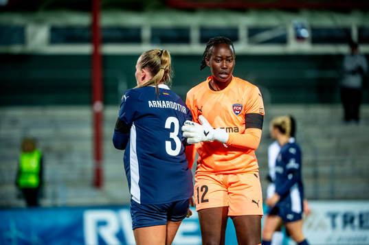 Gudrun Arnardottir and goalkeeper Angel Mukasa of FC