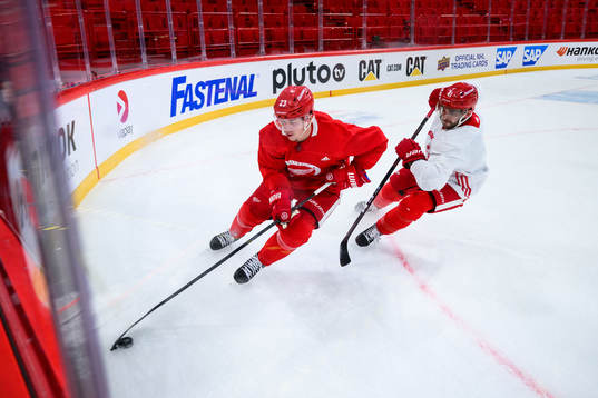 Lucas Raymond and Shayne Gostisbehere of Detroit Red Wings