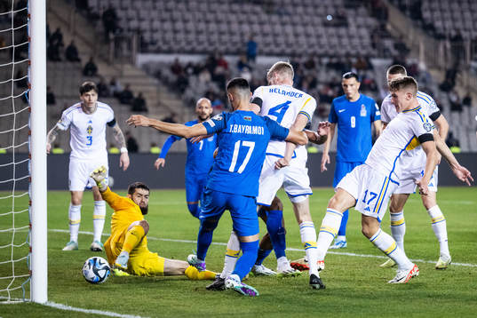 goalkeeper Shakhrudin Magmomedaliyev and Tural Bayramov of