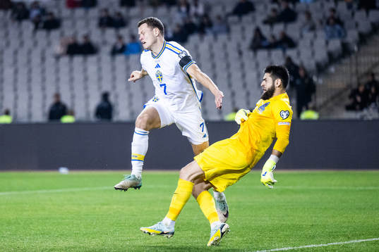 Viktor Claesson of Sweden and goalkeeper Shakhrudin