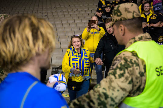 Emil Forsberg of Sweden hands over a jersey to Swedish