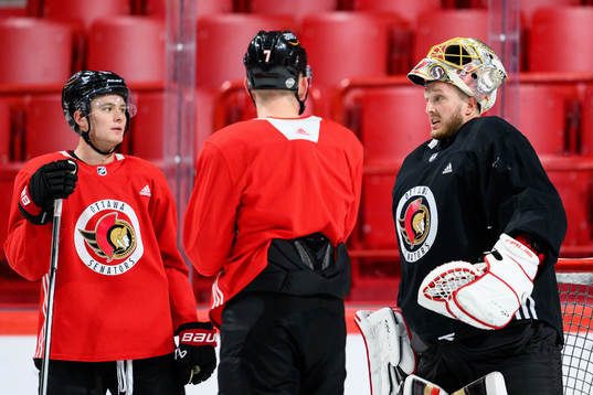 Tim Stutzle, Brady Tkachuk and goalkeeper Anton Forsberg of
