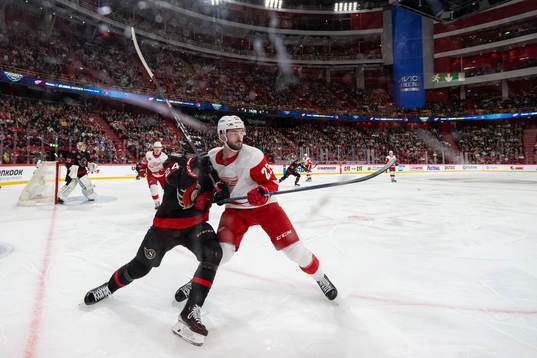 Klim Kostin of Detroit Red Wings and Travis Hamonic of