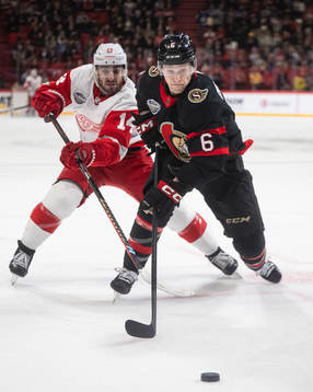 Robby Fabbri of Detroit Red Wings and Jakob Chychrun of
