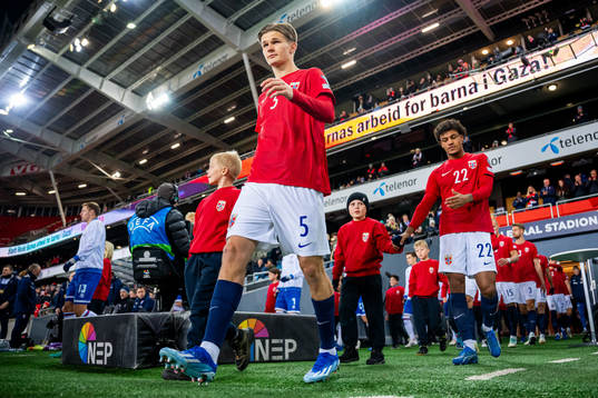 David Møller Wolfe of Norway enters the pitch
