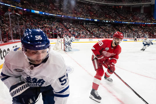 Mark Giordano of Toronto Maple Leafs and Joe Veleno of