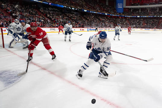 Andrew Copp of Detroit Red Wings and Mark Giordano of