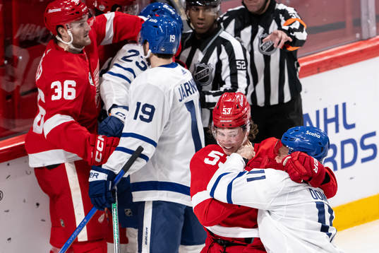 Moritz Seider of Detroit Red Wings and Max Domi of Toronto