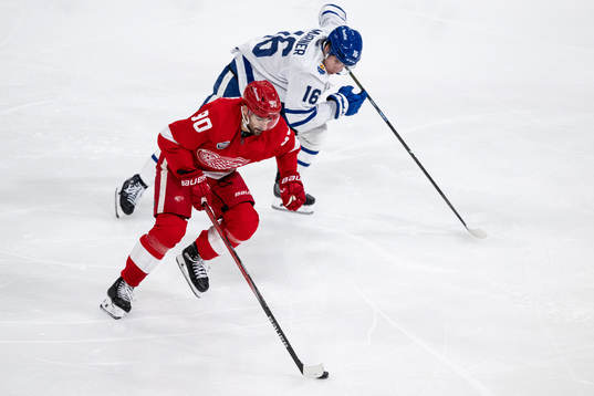 Joe Veleno of Detroit Red Wings and Mitchell Marner of