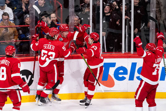 Lucas Raymond of Detroit Red Wings celebrate with teammates