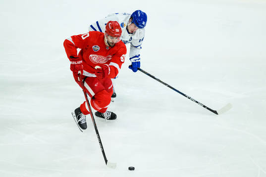 Joe Veleno of Detroit Red Wings and Mitchell Marner of