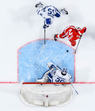 Mark Giordano and goalkeeper Ilya Samsonov of Toronto Maple